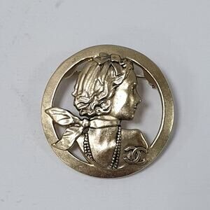 Chanel Gold-Tone Mademoiselle Brooch - Elegant & Iconic